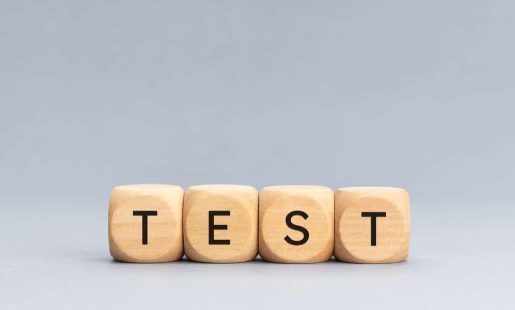 word test spelled in small wooden blocks