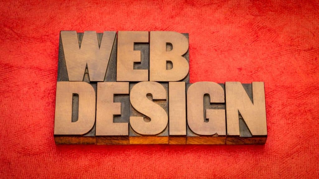 web design word abstract in vintage letterpress wood