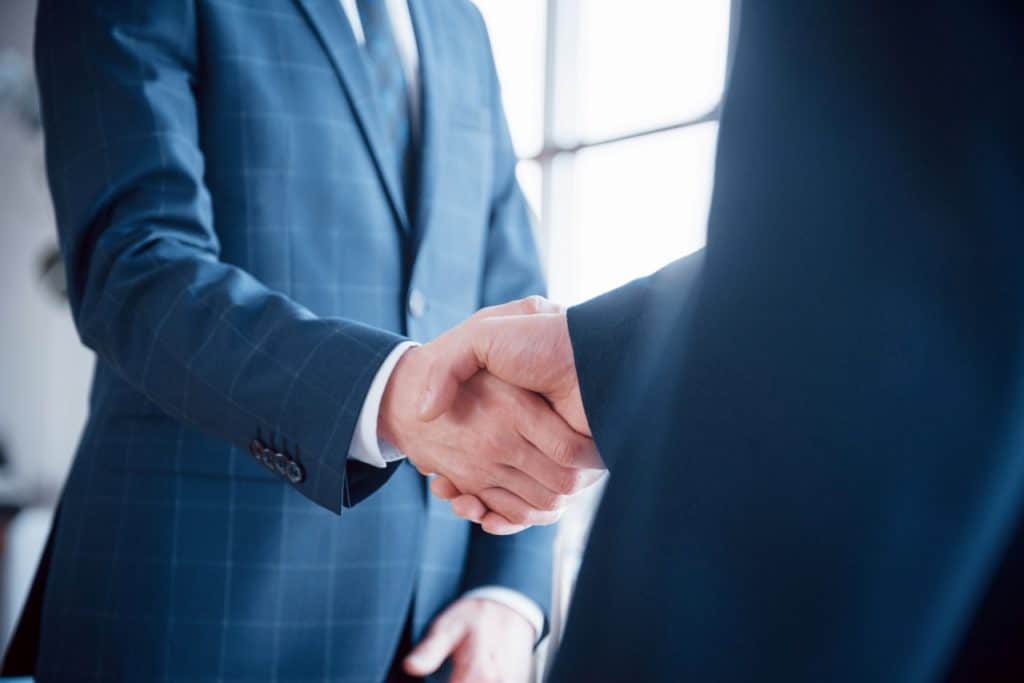 men in suit shaking hands